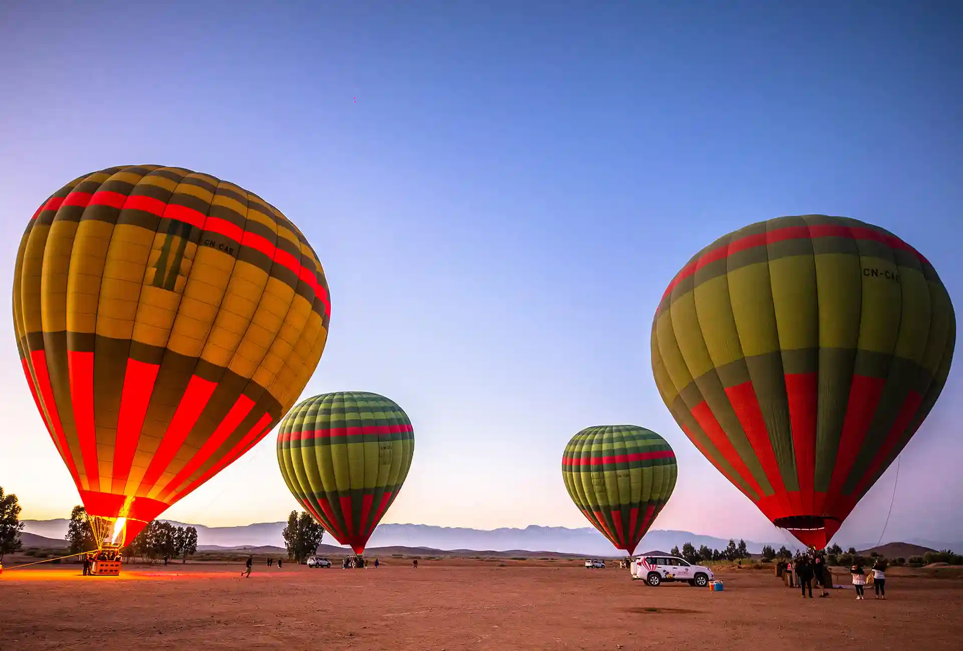 Hot air balloon flight over Marrakech at sunrise Hot air balloon flight over Marrakech at sunrise — Atlas Mountains in the distance